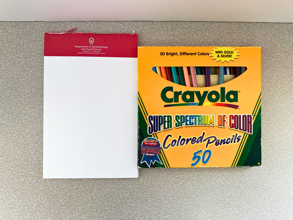 notepad and colored pencils