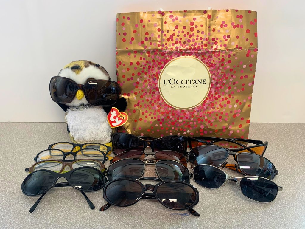 Sunglasses, bag, and stuffed owl plushie