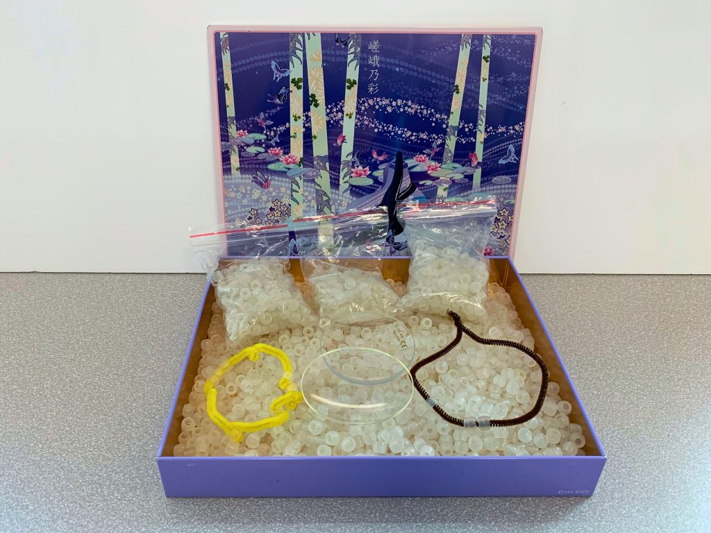 Container of UV reactive beads