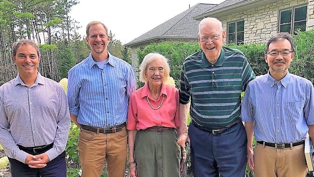 A picture of Sandra and Monroe Trout standing with three endowed Trout Chairs (Michael Altaweel, David Gamm, and Aki Ikeda) in a garden setting.